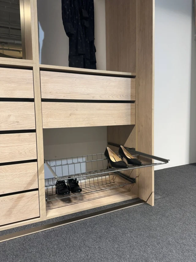 Oak wardrobe interior with drawers and a pull-out shoe rack